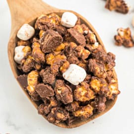 Fluffernutter Caramel Corn - A peanut butter popcorn that's coated with chocolate and marshmallow for a sweet, salty, decadent snack that no one can resist!