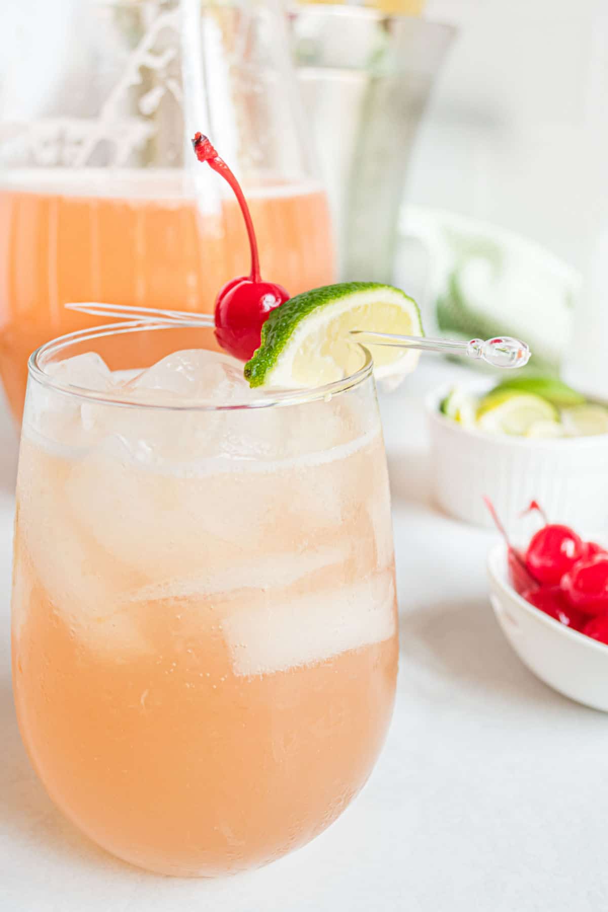 Clear glasses filled with iced cherry beer margaritas.