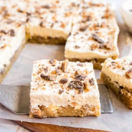 Chewy Apple Blondies topped with a caramel buttercream and toffee bits. One of my favorite apple desserts!