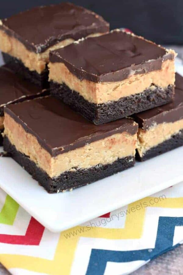 These Buckeye Brownies are amazing! Rich chocolate brownies topped with a homemade peanut butter filling and chocolate ganache.