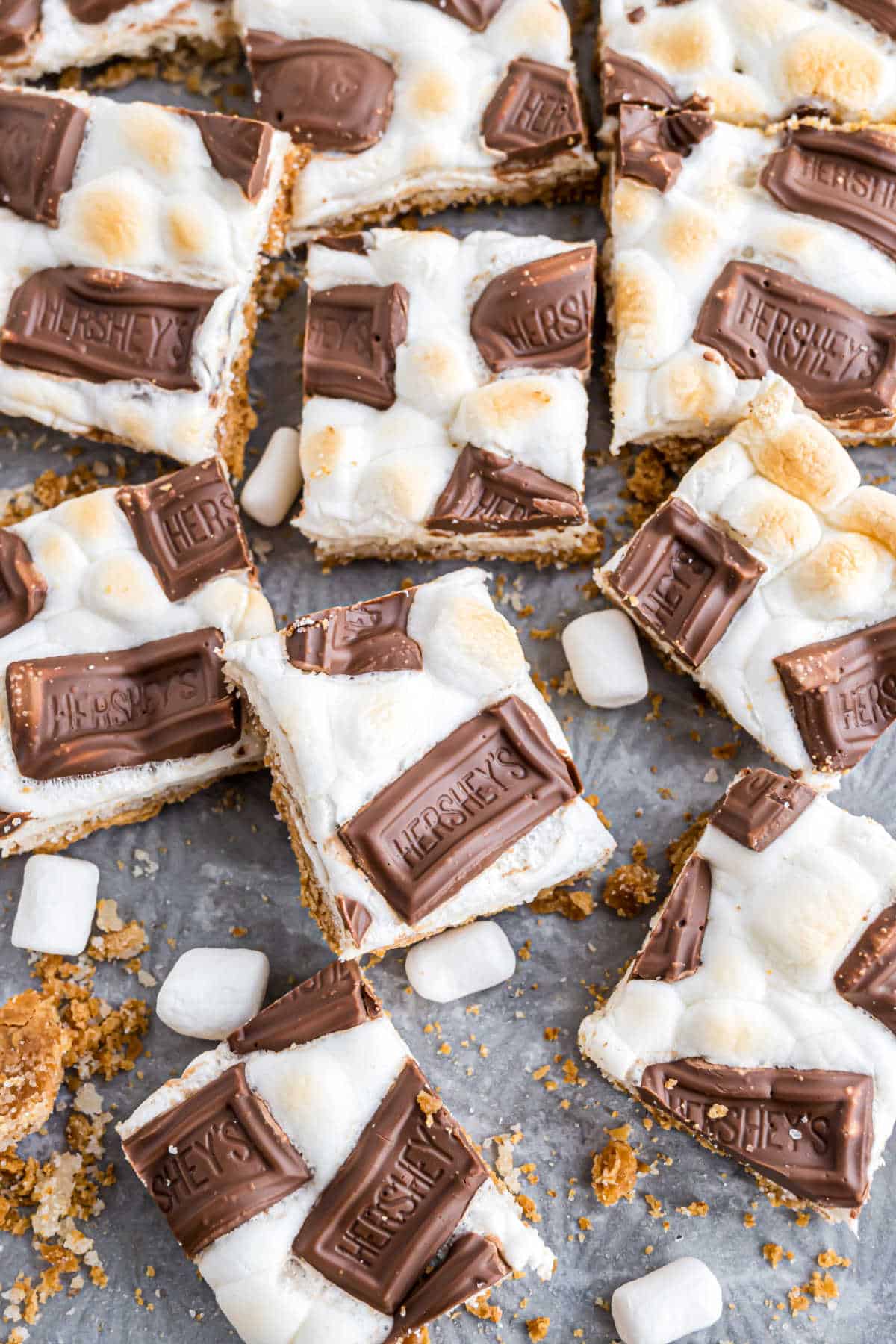 Squares of s'mores toffee on a cookie sheet.