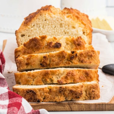 Beer Bread is an easy, buttery bread without yeast to serve with dinner tonight! Enjoy a warm slice fresh from the oven, or slice it into cubes to serve with all your favorite dips.