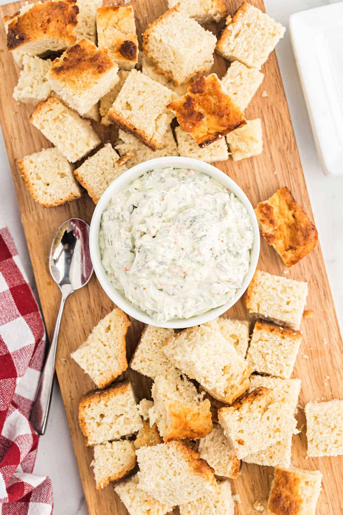 Spinach dip served with beer bread cubes.