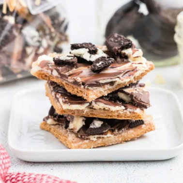 Oreo Graham Cracker Toffee is a sweet and scrumptious snack! This recipe layers crunchy cracker toffee with white chocolate and Oreos for a treat everyone will devour.