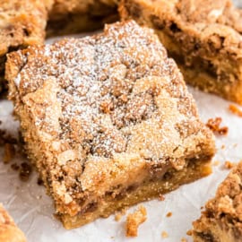 Cinnamon Sour Cream Coffee Cake is a tender coffee cake filled with a cinnamon swirl and topped with a delicious brown sugar streusel.