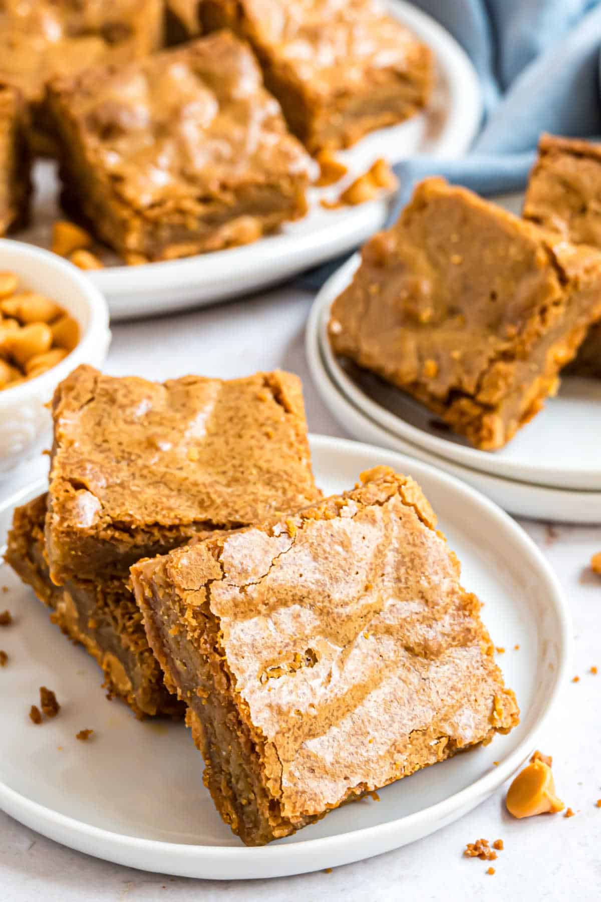 Two blondies on a white plate.