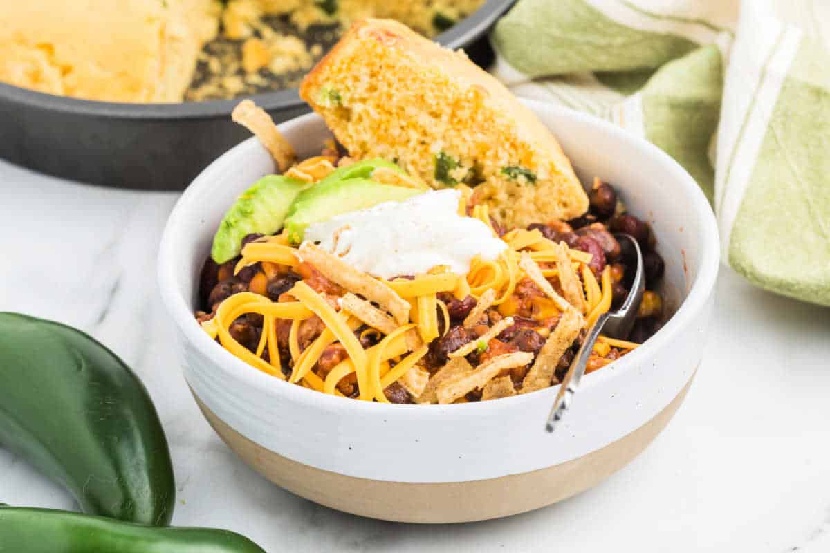 Slow Cooker meals are not only perfect for busy weeknight dinners, but also great for weekend entertaining too! Serve this easy Taco Chili recipe with a side of cornbread and all the fixings for a flavorful dinner.