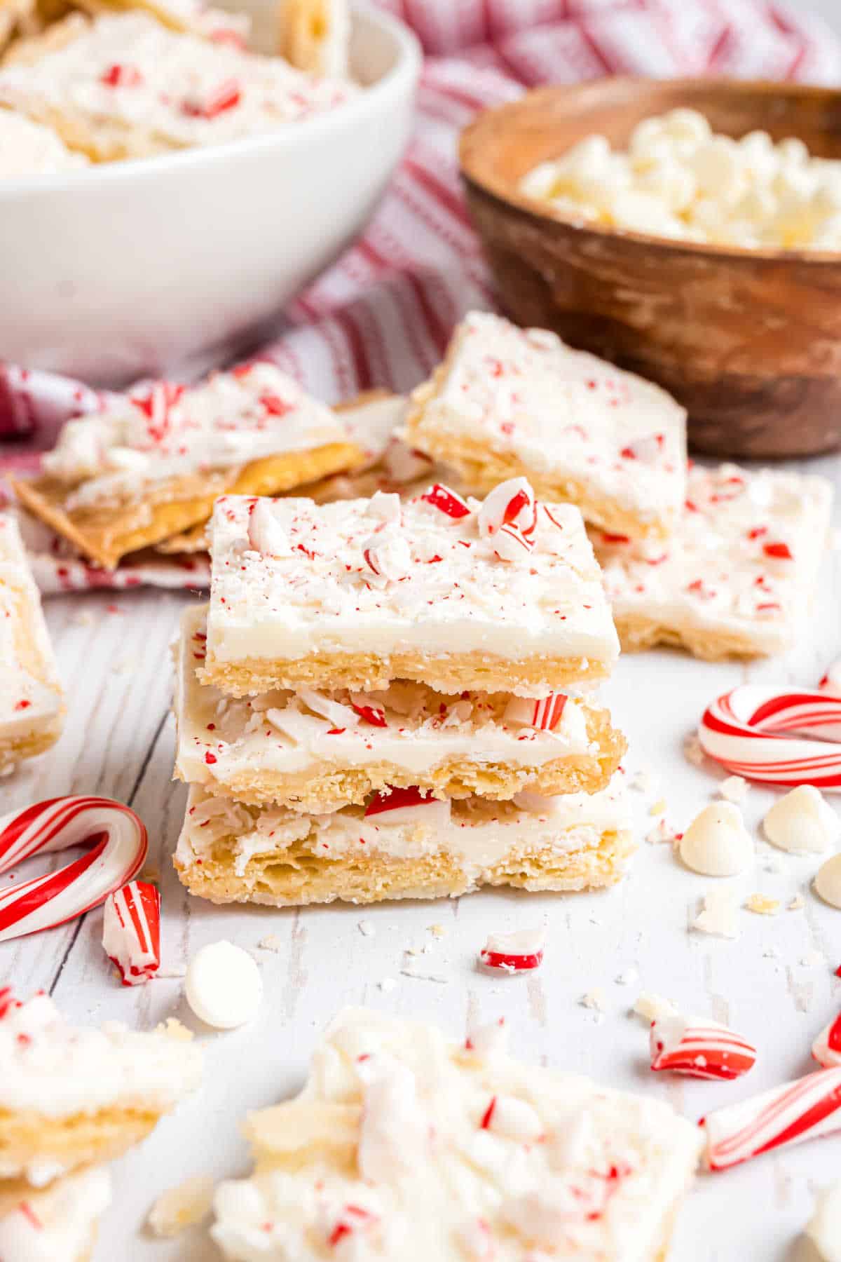 Stack of three pieces of peppermint cracker toffee.