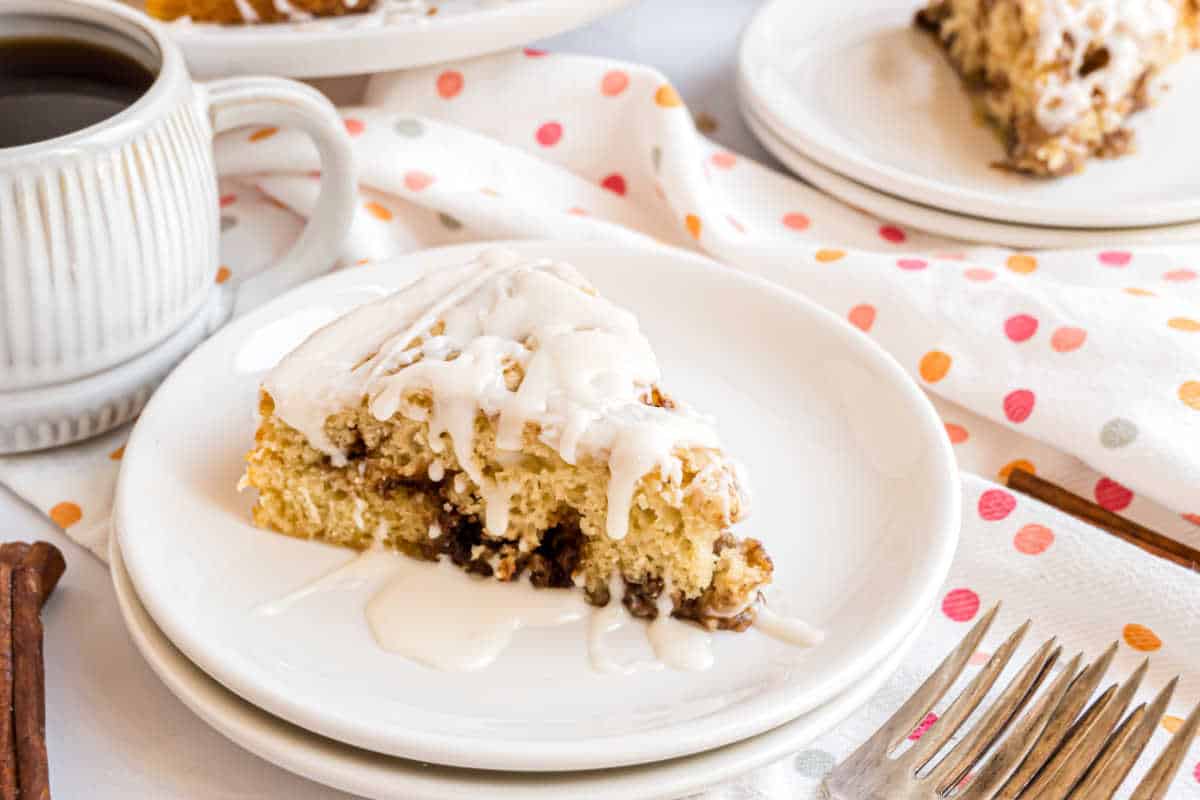 This Cinnabon Cake mixes the best parts of a cinnamon roll and coffee cake for a delicious breakfast treat. The sweet vanilla icing is the perfect finishing touch!