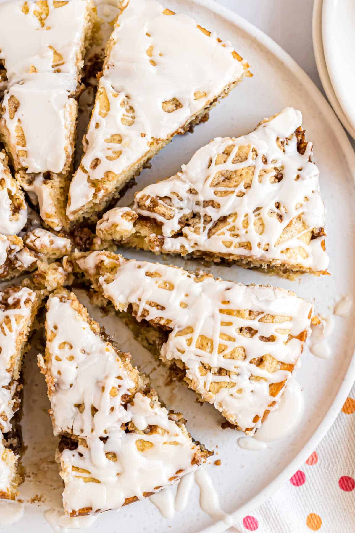 Cinnamon roll coffee cake cut into slices.