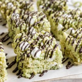 Made with pudding mix and drizzled with dark chocolate, these are not your everyday Rice Krispie Treats! Try this pistachio dessert that puts a new twist on your childhood favorite.