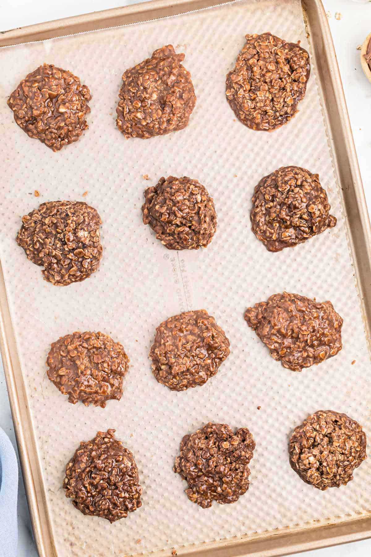 Cookies with nutella on a parchment paper lined cookie sheet.