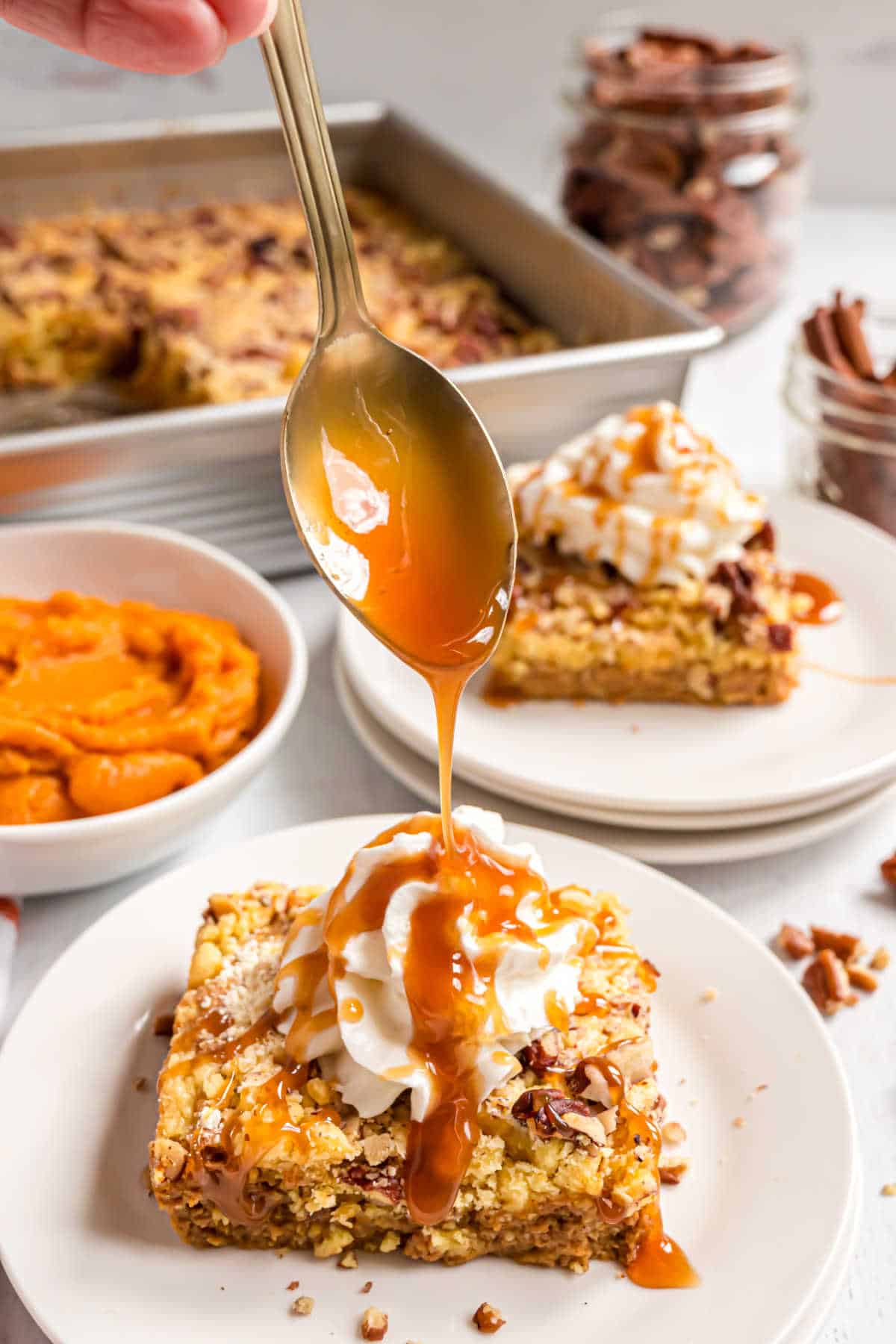 Drizzle of caramel sauce over the top of pumpkin cake.