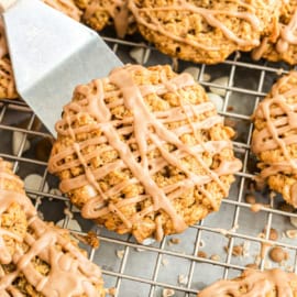 Soft and chewy Pumpkin Oatmeal Cookies with white chocolate morsels and maple glaze need a place in your cookie jar this fall!