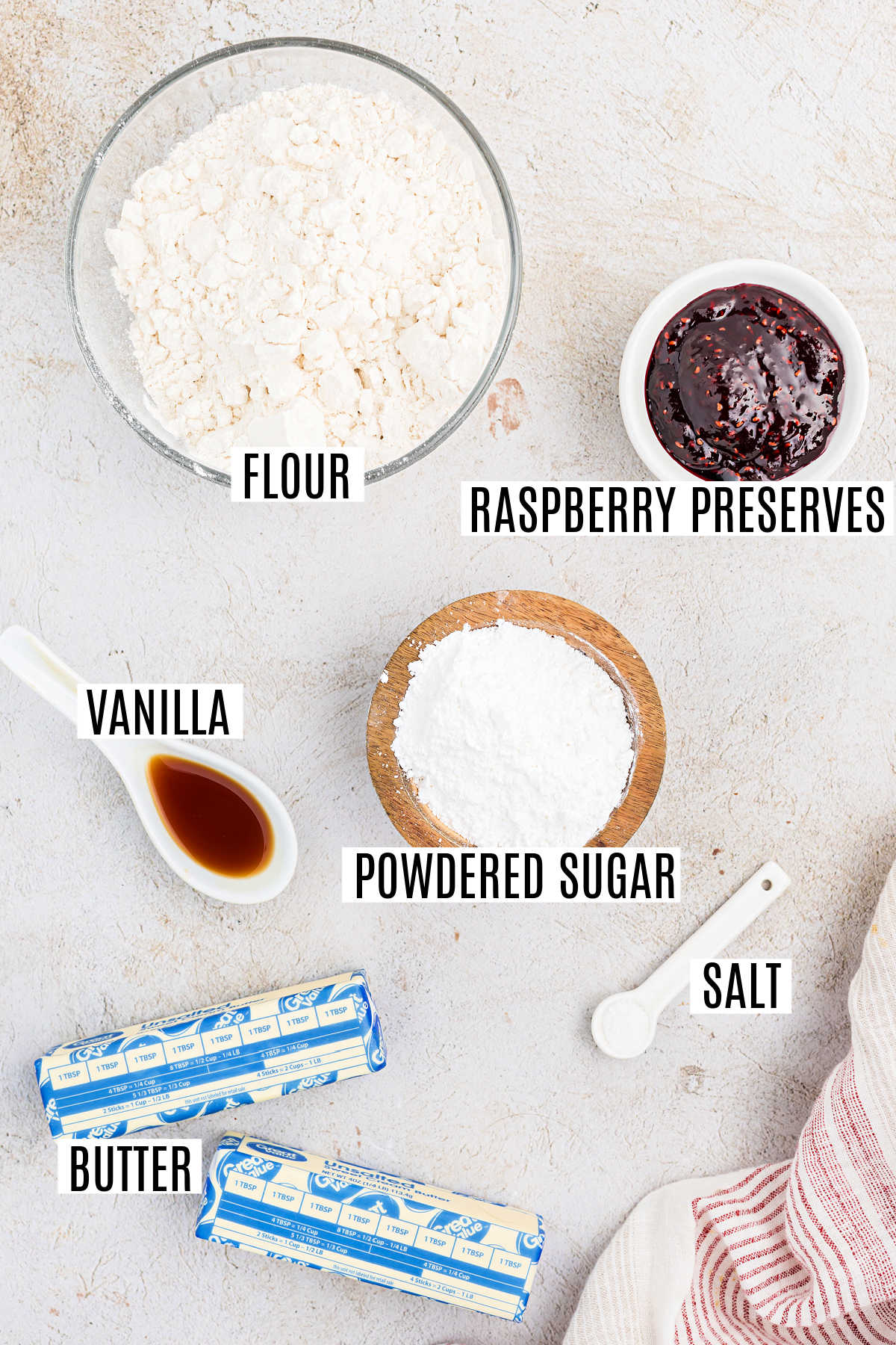 Ingredients needed to make raspberry jam cookies.