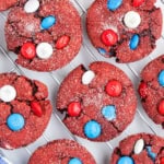 Red velvet cake mix cookies on a wire cooling rack.