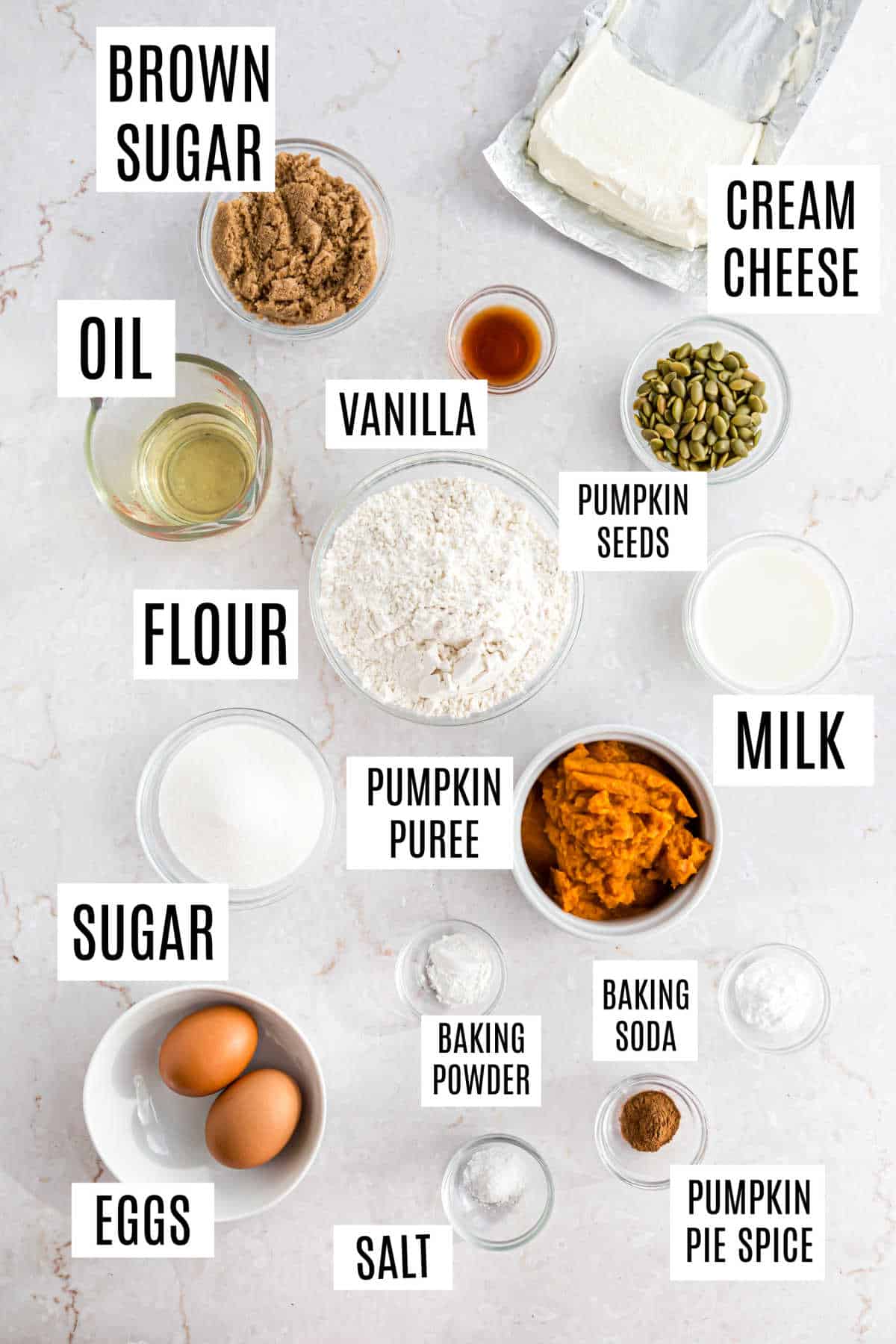 Ingredients needed to make pumpkin cream cheese muffins.