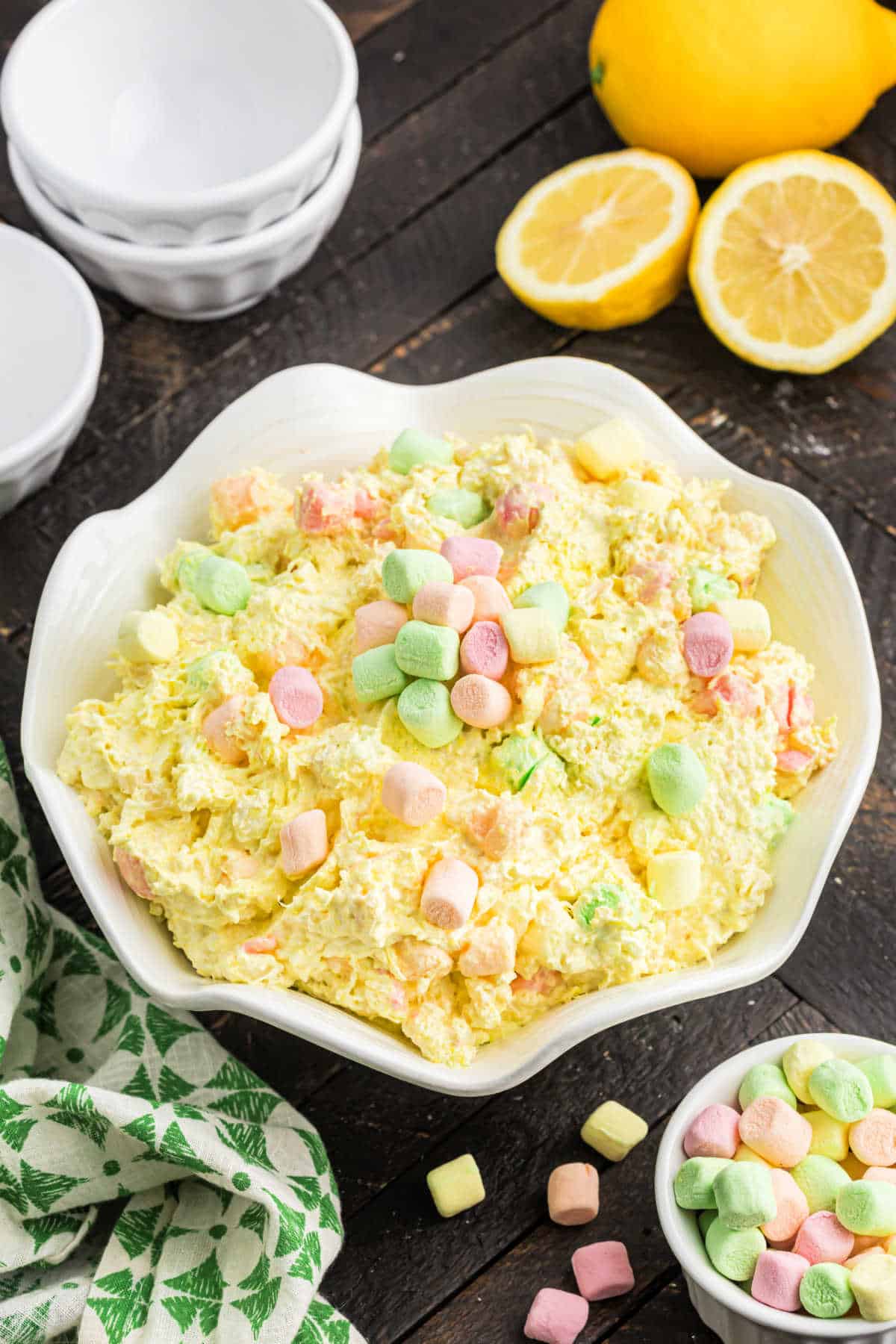 Scalloped white bowl filled with lemon salad.