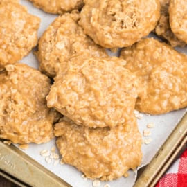 Stack of biscoff oatmeal cookies on parchment paper.