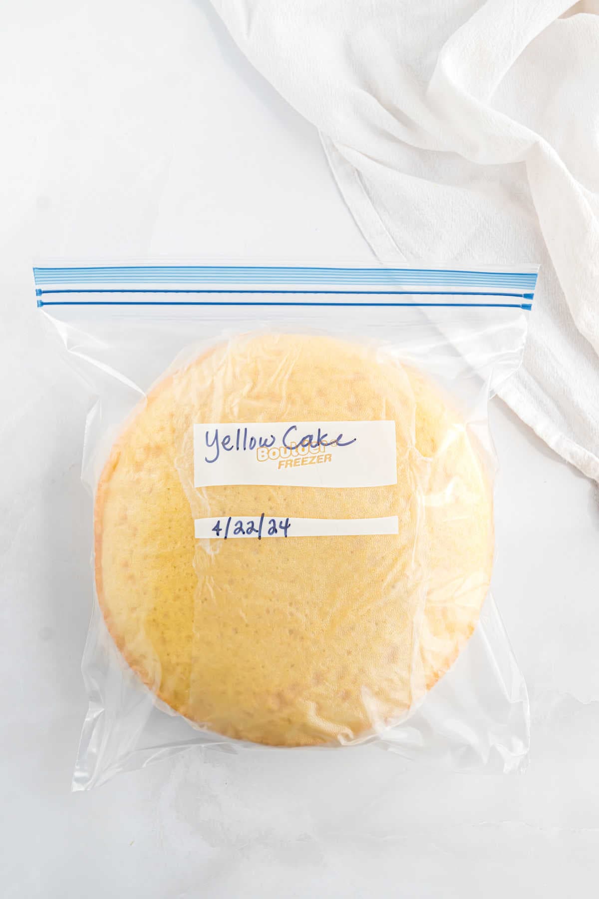 Two cake layers in a ziploc freezer bag.