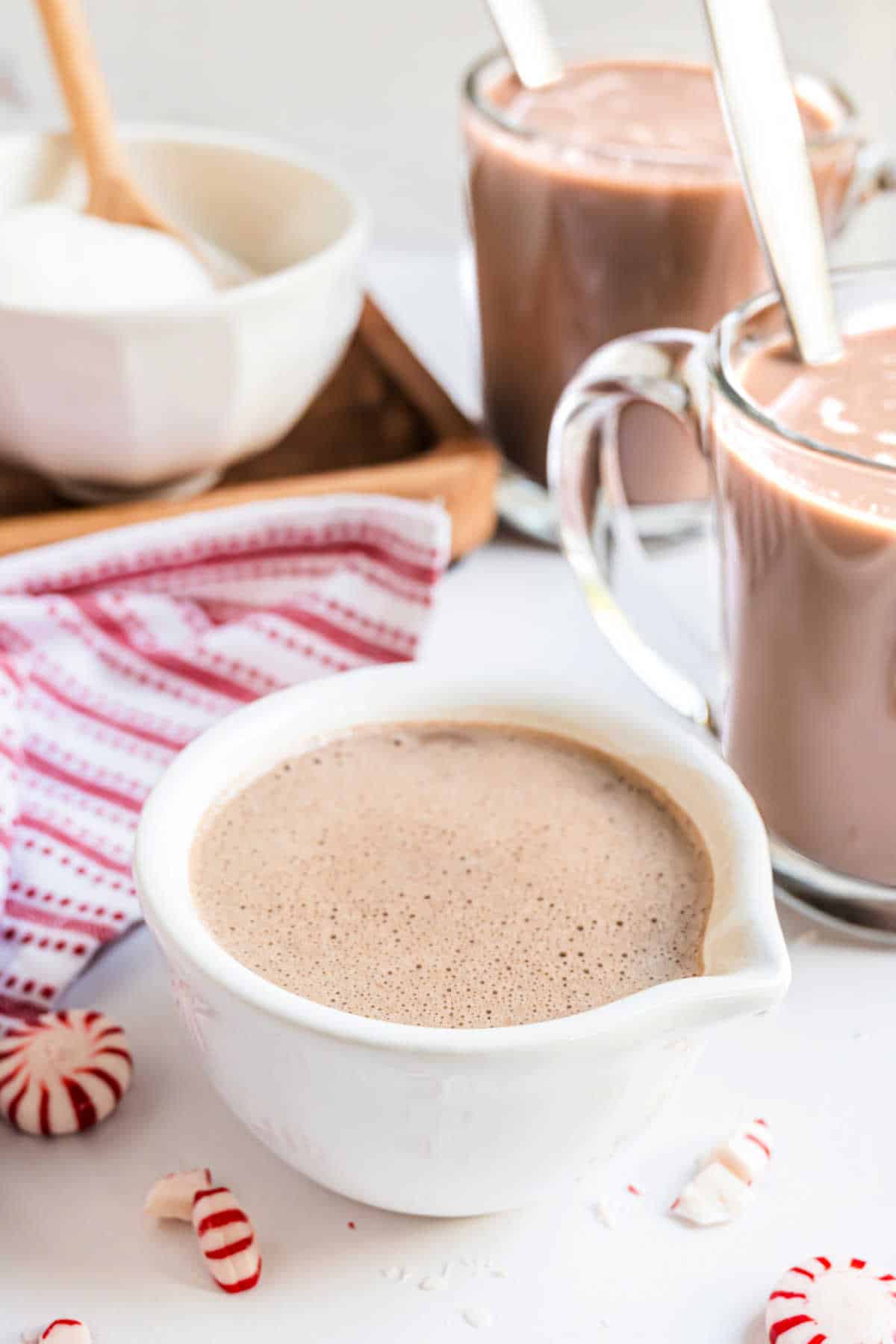 Homemade peppermint coffee creamer in a white pitcher.