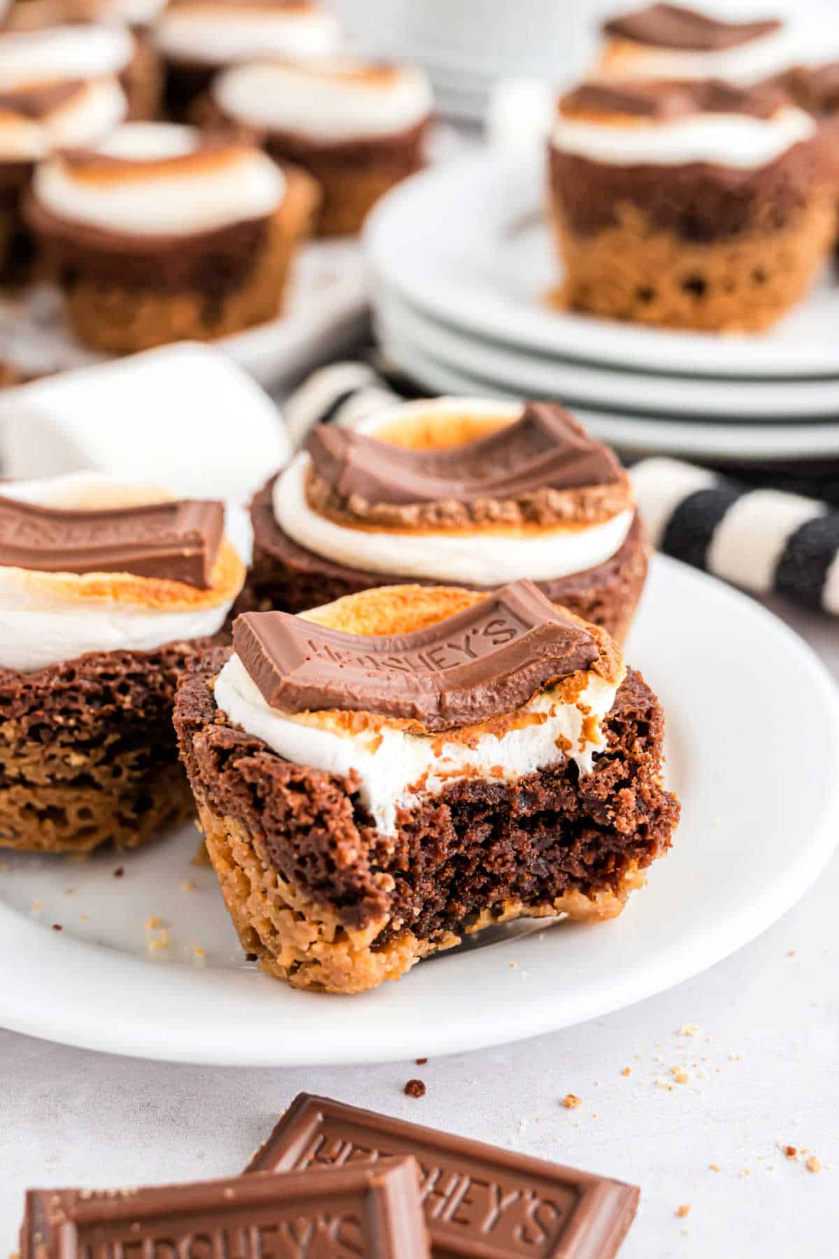 Smores brownie bites with a bite taken out.