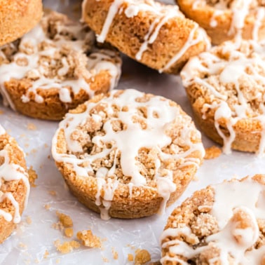 Coffee cake cookies with icing baked in a muffin tin.