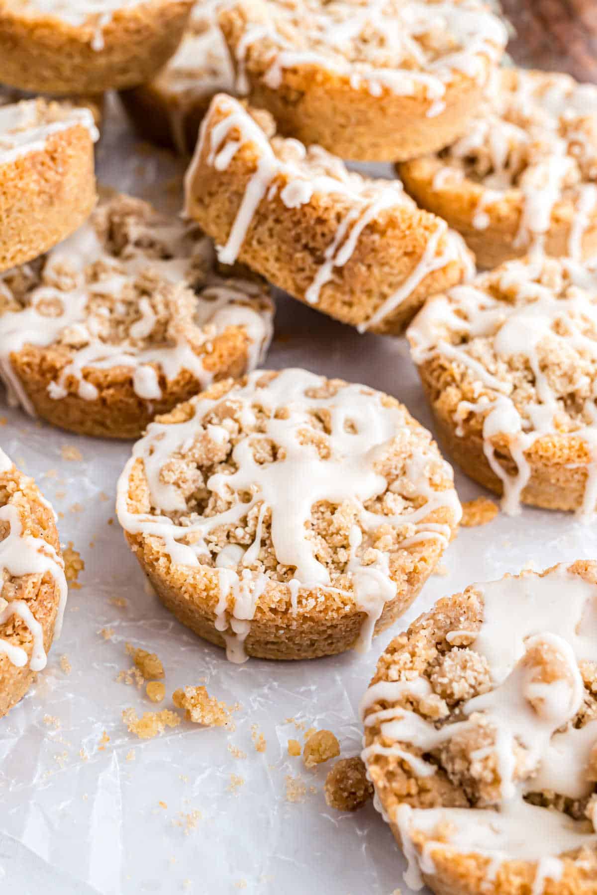 Iced coffee cake cookies on parchment paper.