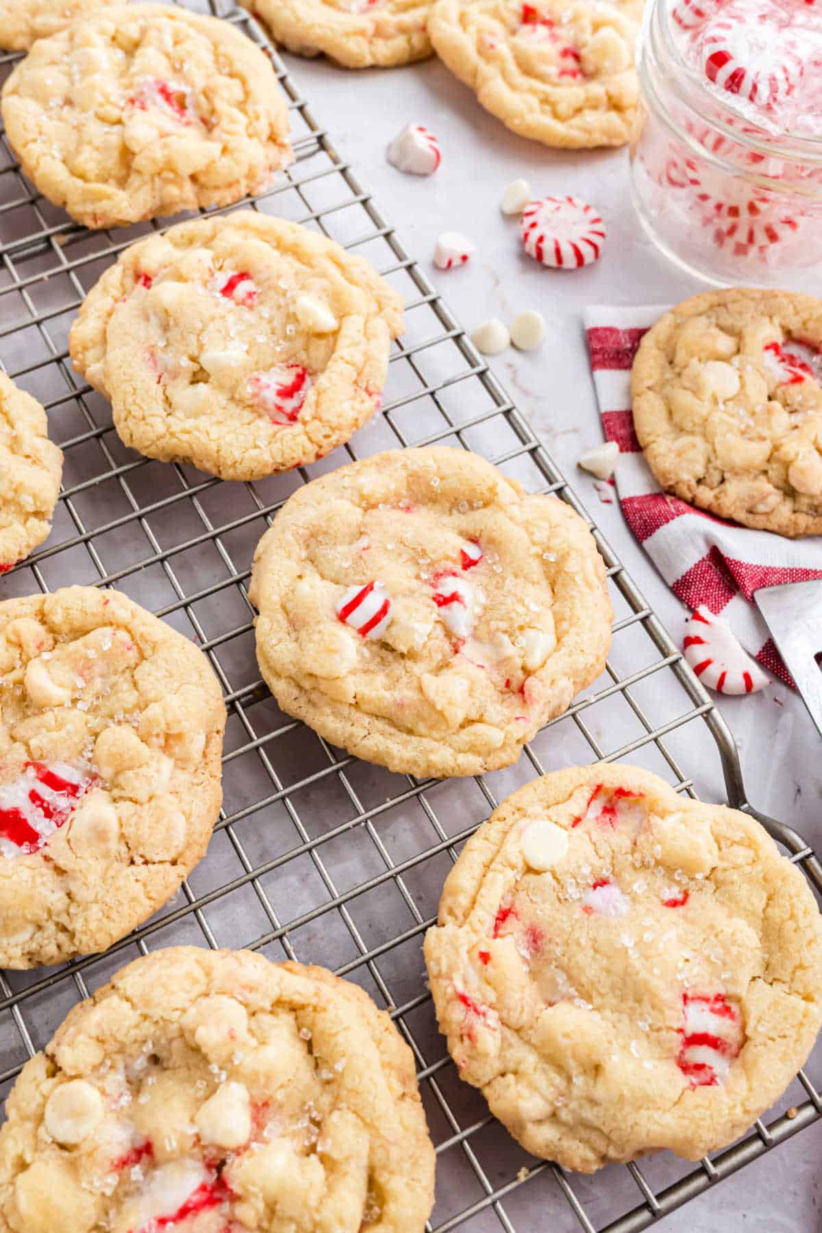 White chocolate peppermint cookies on a wire cooling rack.