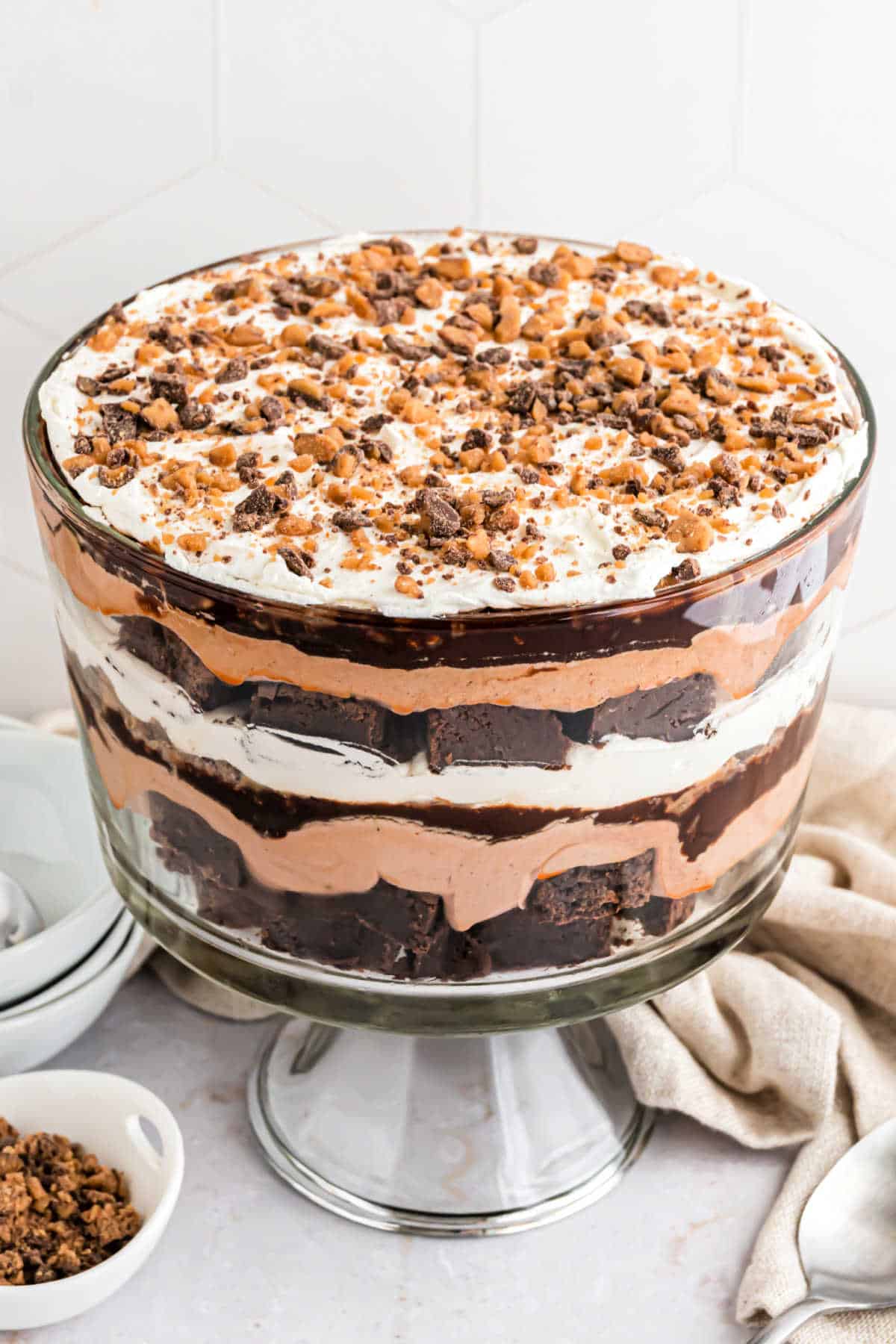 Chocolate pudding dessert assembled in a trifle bowl.