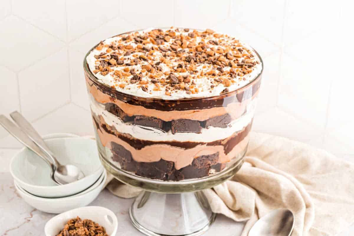 Brownie trifle assembled in a glass bowl.