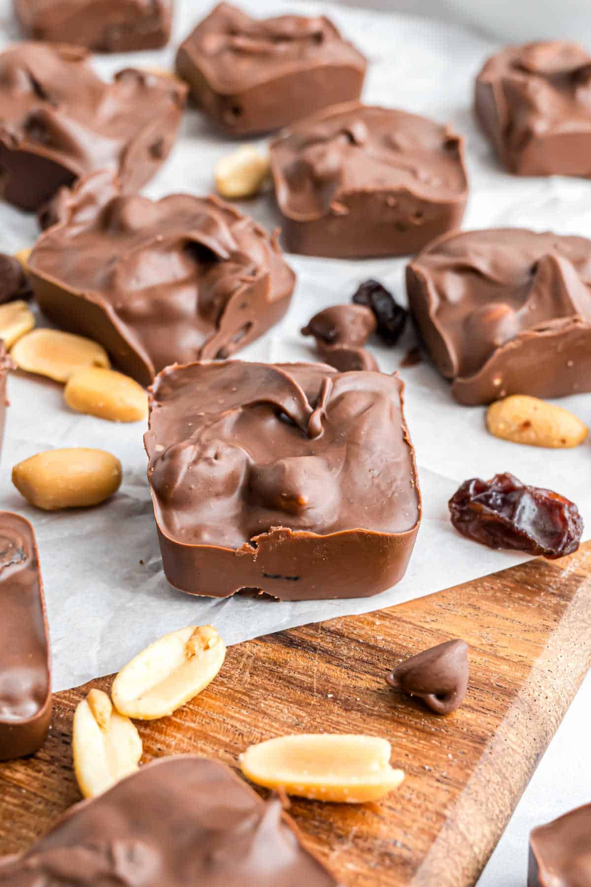 Chocolate candy squares with nuts and raisins.