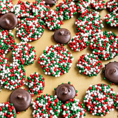 Who knew you could make homemade Chocolate Nonpareils Candy?! This easy candy recipe is perfect for tucking into Christmas cookie trays during the holidays.