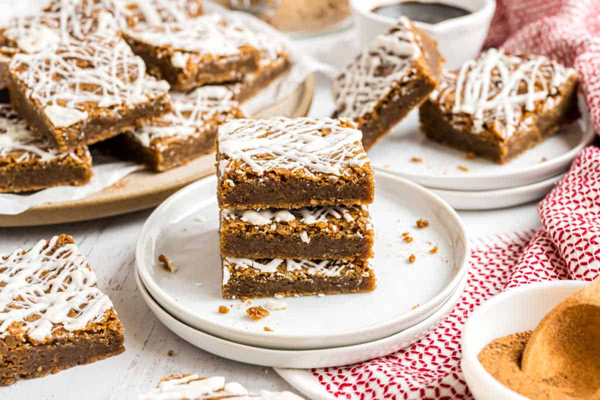 Stack of three blondies on a white plate.