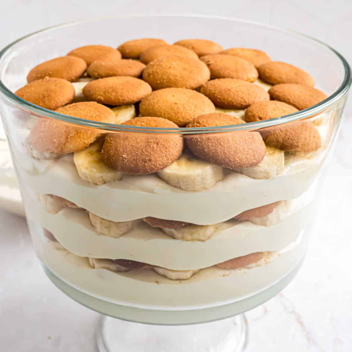 Layered banana pudding in a trifle bowl.