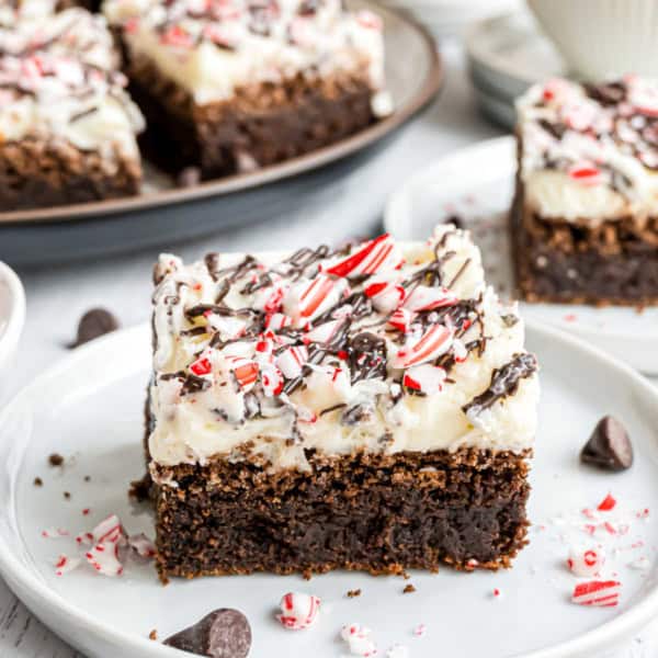 Rich, minty, and oh-so-fudgy, these Peppermint Brownies are a crowd-pleasing holiday treat! Peppermint frosting and chocolate are topped with crunchy bits of peppermint candy canes!