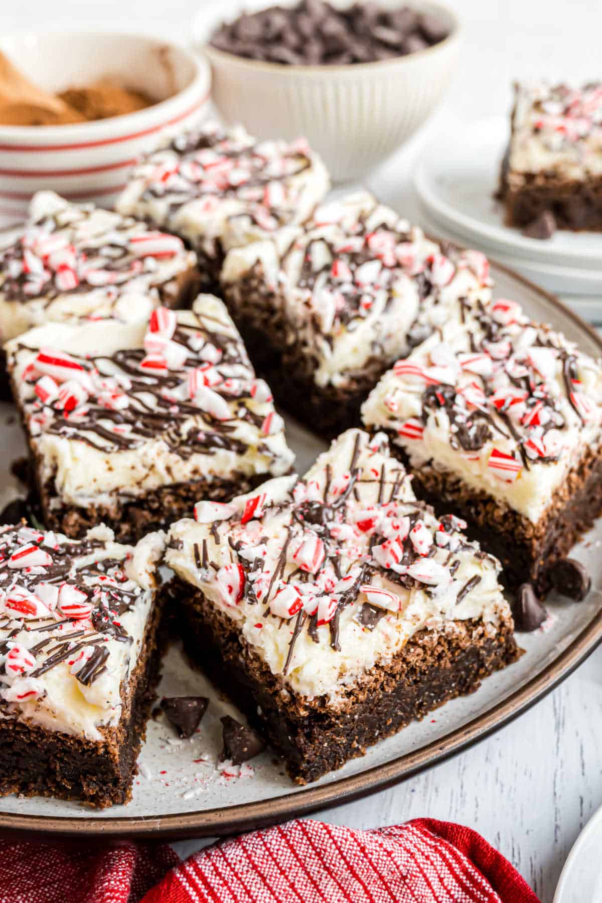 Brownies with peppermints on a serving tray.