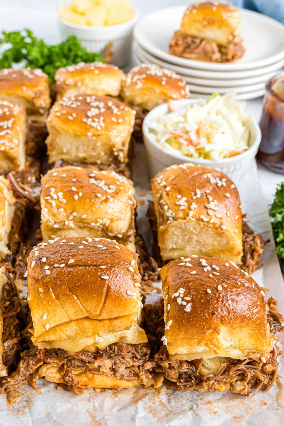 Pulled pork sliders cut into squares and served with cole slaw.