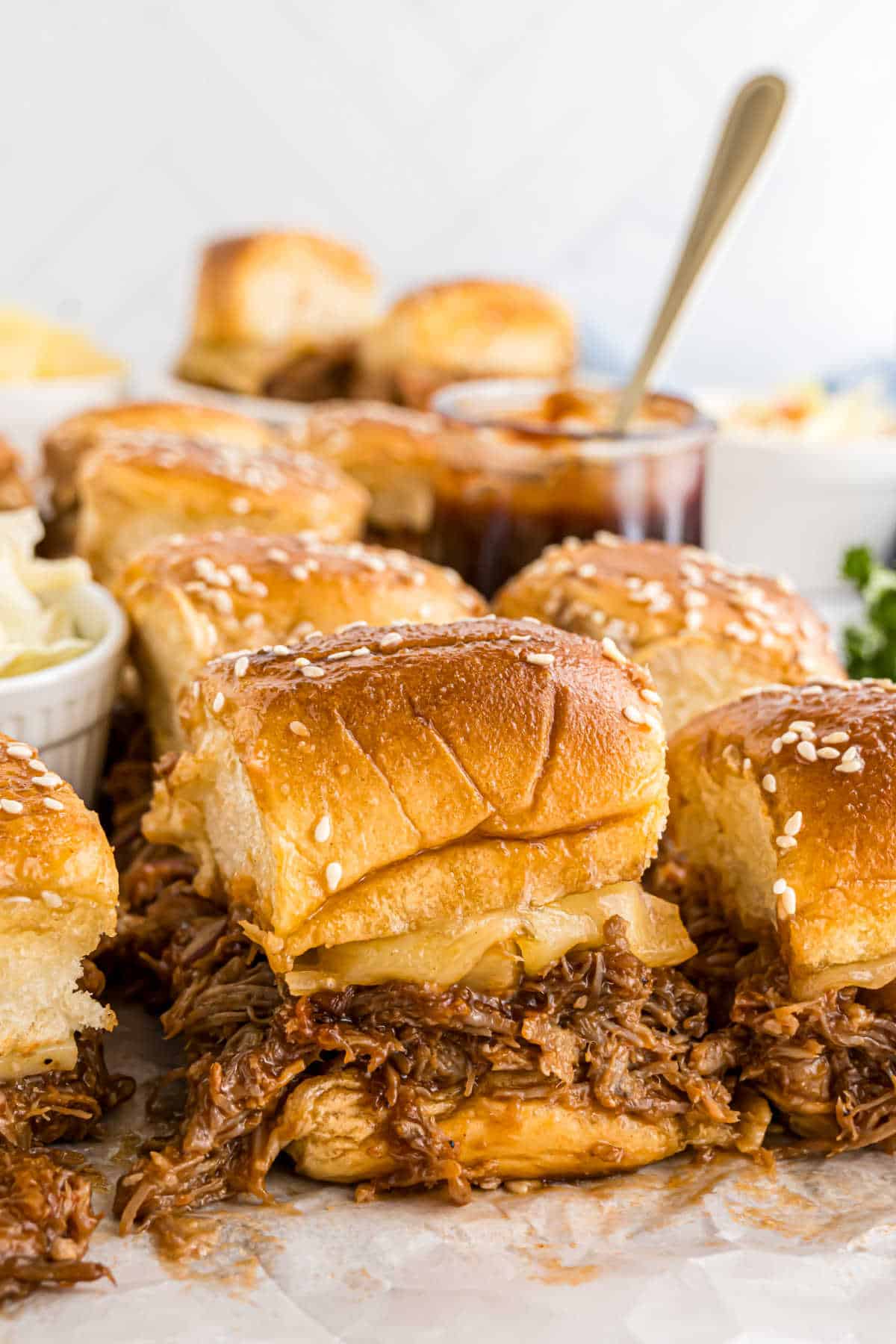 Pulled pork sliders cut into squares.