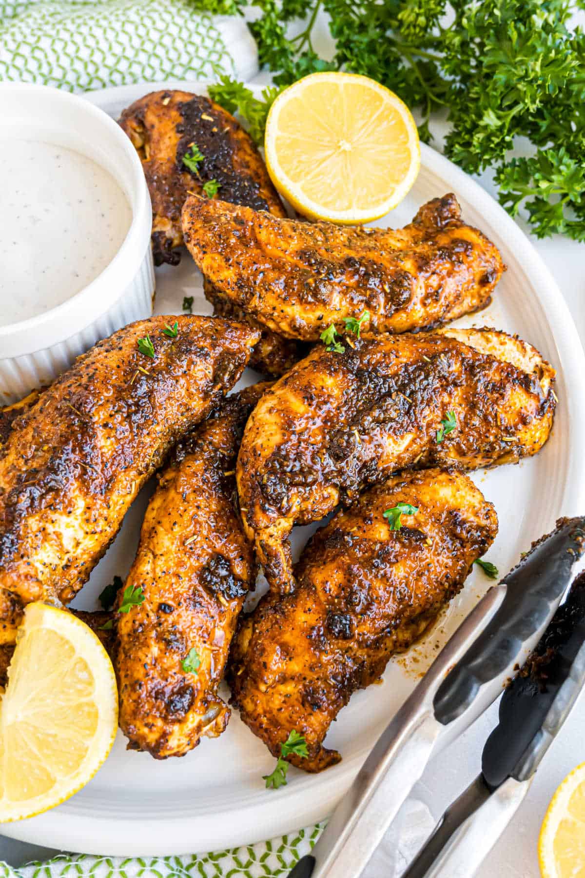 Chicken tenders grilled with blackened seasoning and served with fresh lemon.