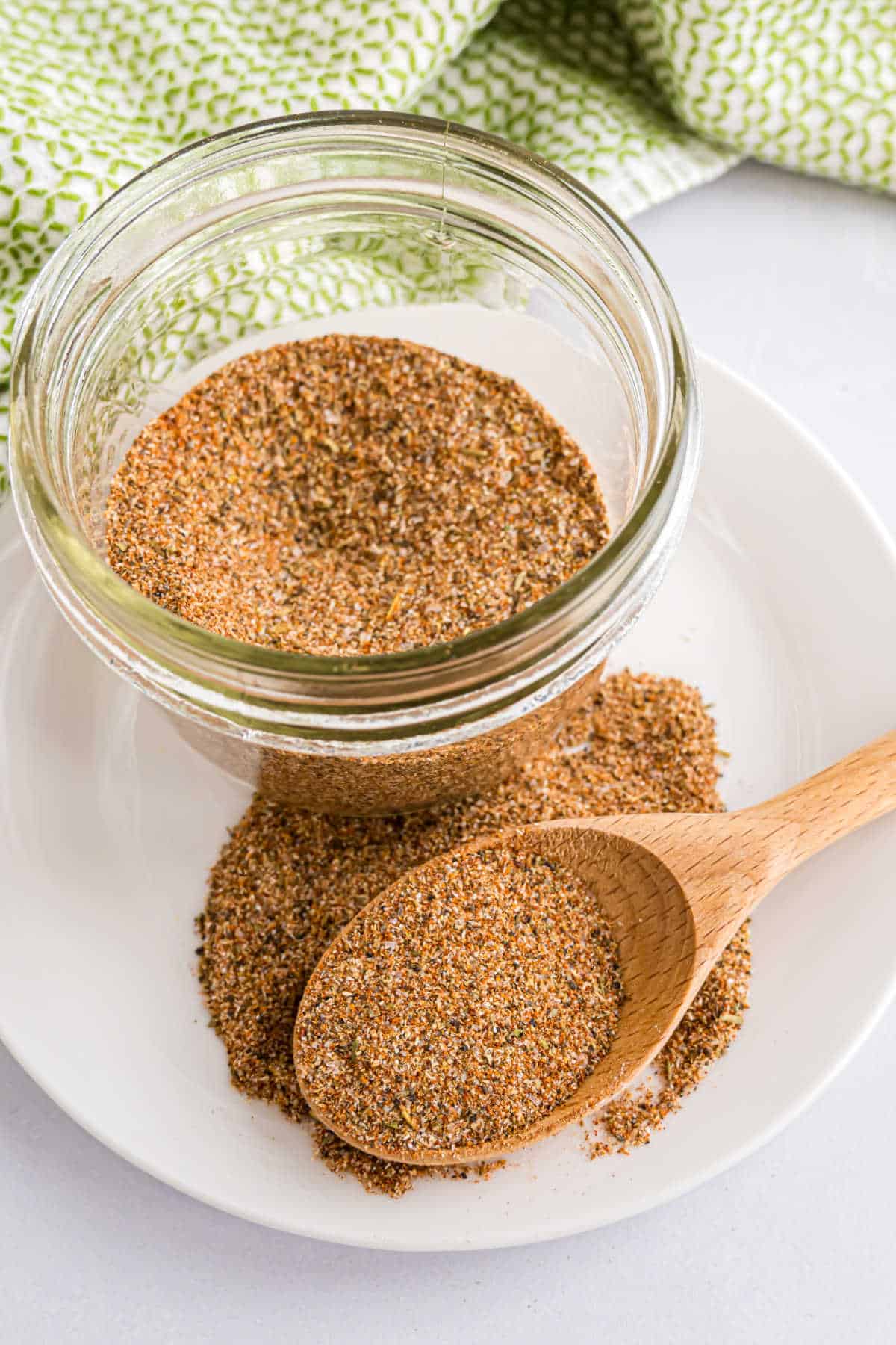 Blackened seasoning mix in a bowl with a spoon.