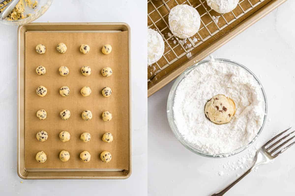 Cookie dough balls on a baking sheet sit beside chocolate chip snowball cookies on a wire rack. A single cookie is being coated in powdered sugar in a glass bowl with a fork nearby.