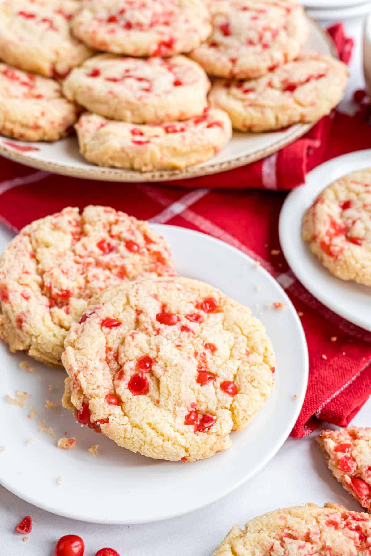 Small white plate with two red hot cookies.