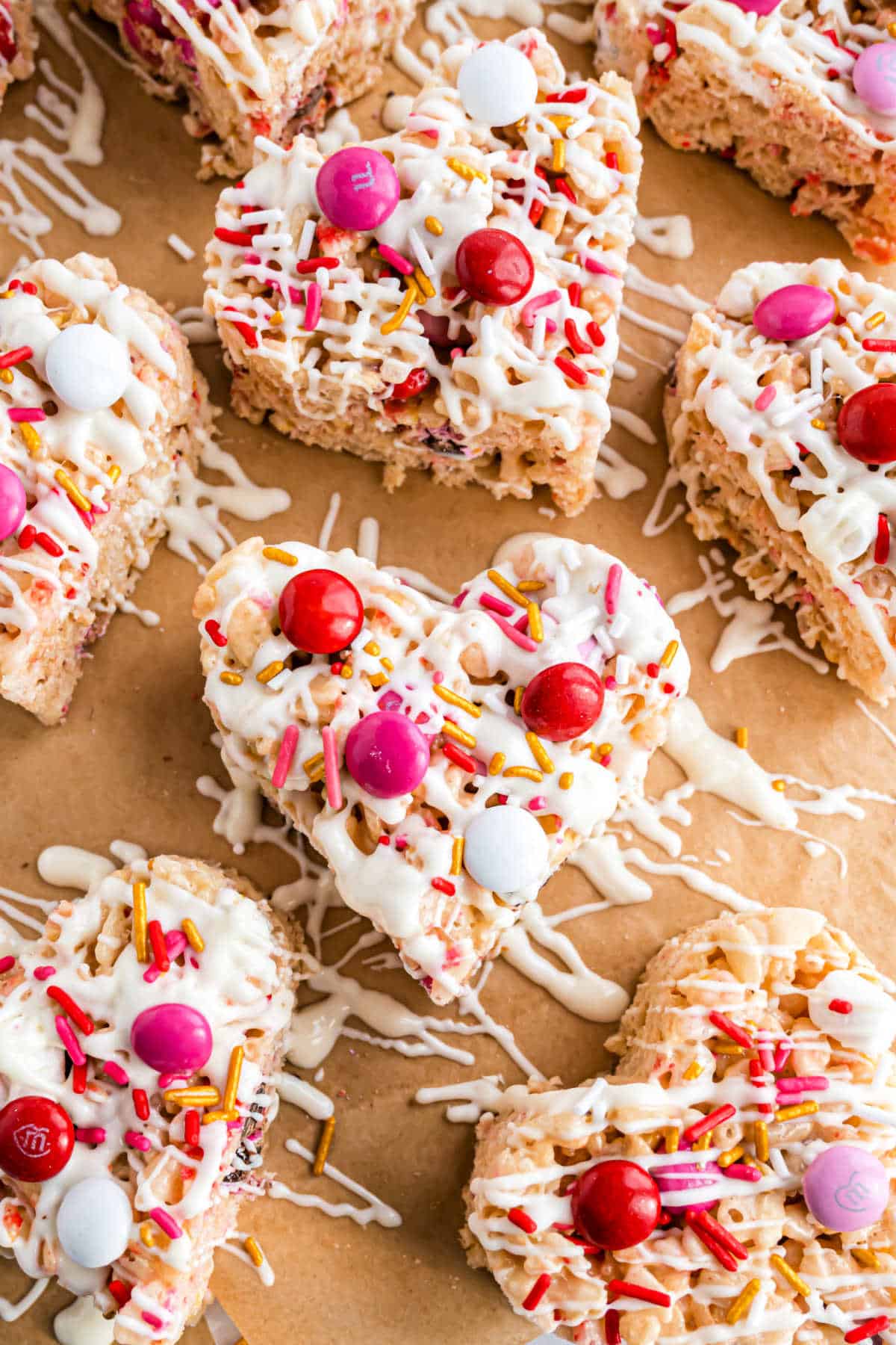 Heart shaped rice krispie treats with valentine sprinkles.