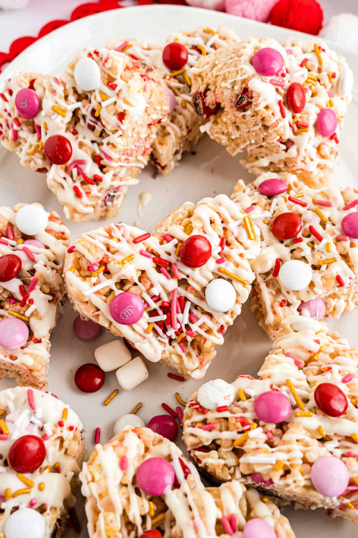 Heart shaped rice krispie treats loaded with Valentine M&Ms.