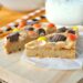 Perfect Peanut Butter Cookie Bars: Made with Reese's and peanut butter fudge on a peanut butter cookie crust! The kids will go nuts for these sweet homemade treats.